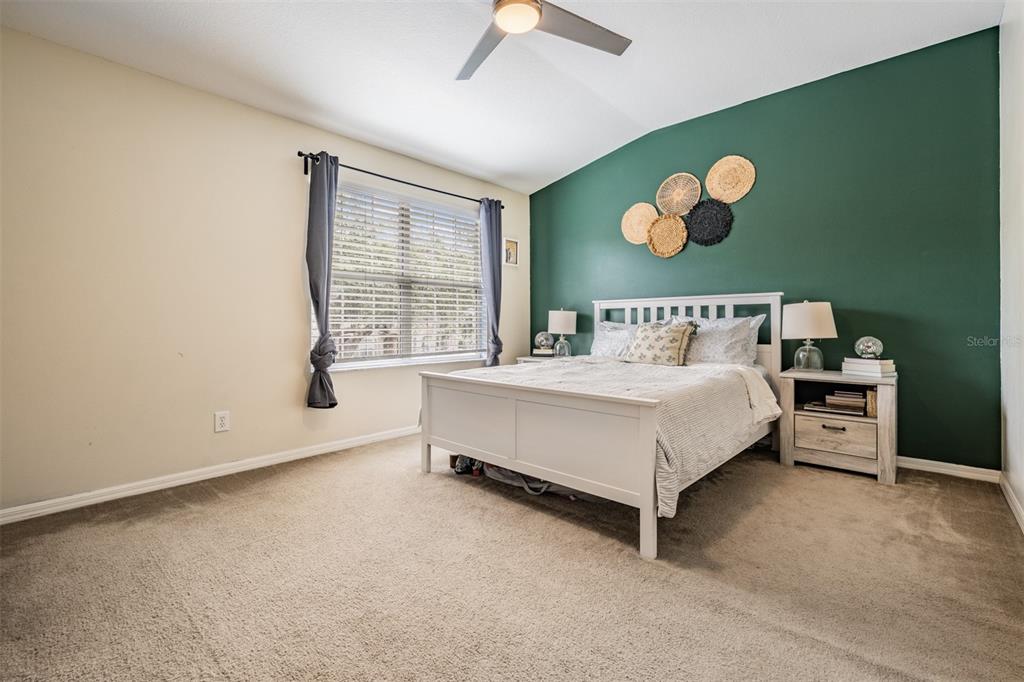 5886 Fishhawk Ridge Drive Lithia, FL 33547 - Photo 13 of 37 a bed sitting in a room next to a window