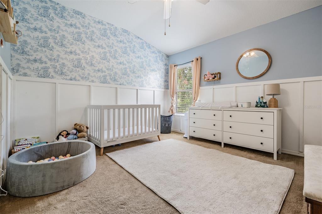 5886 Fishhawk Ridge Drive Lithia, FL 33547 - Photo 17 of 37 a bedroom with a couch and a dresser