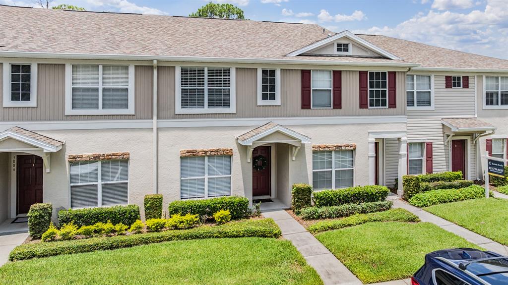 5886 Fishhawk Ridge Drive Lithia, FL 33547 - Photo 30 of 37 a front view of a house with a yard