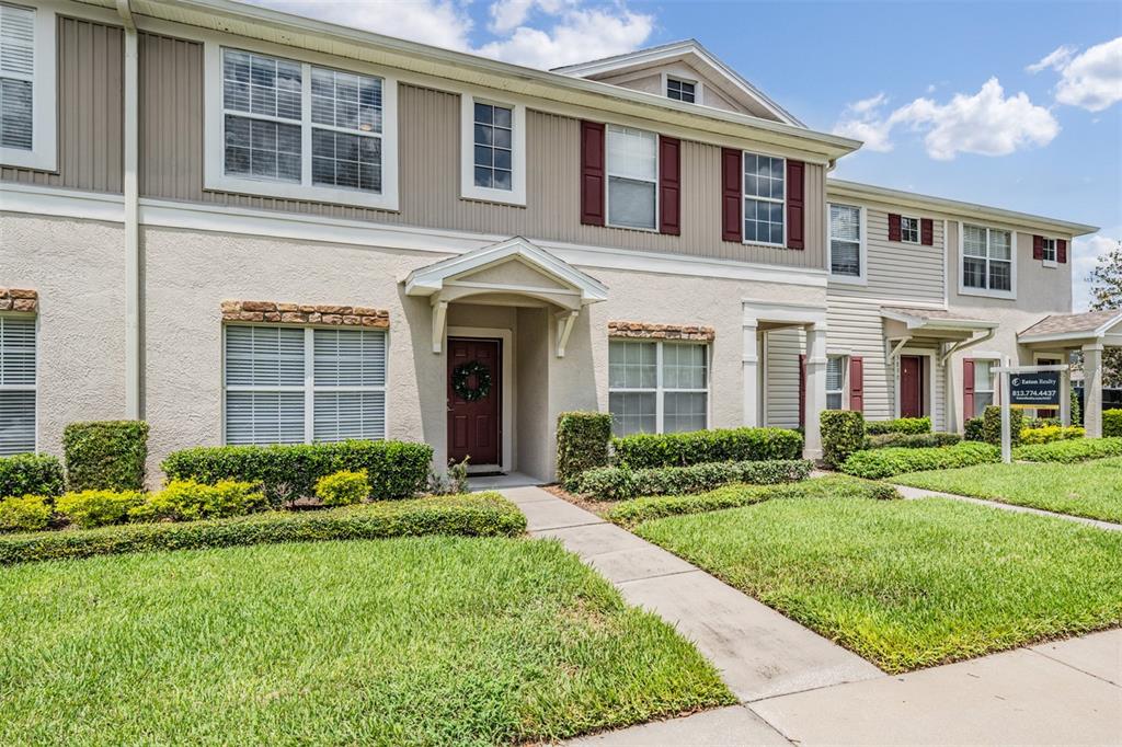 5886 Fishhawk Ridge Drive Lithia, FL 33547 - Photo 33 of 37 front view of a brick house with a yard