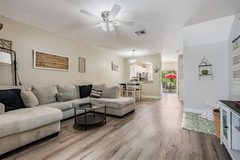 5886 Fishhawk Ridge Drive Lithia, FL 33547 - Photo 4 of 37 a living room with furniture and wooden floor