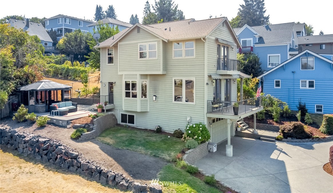 1203 South 3rd Street Renton, WA 98057 - Photo 2 of 40 a view of a house with backyard and sitting area