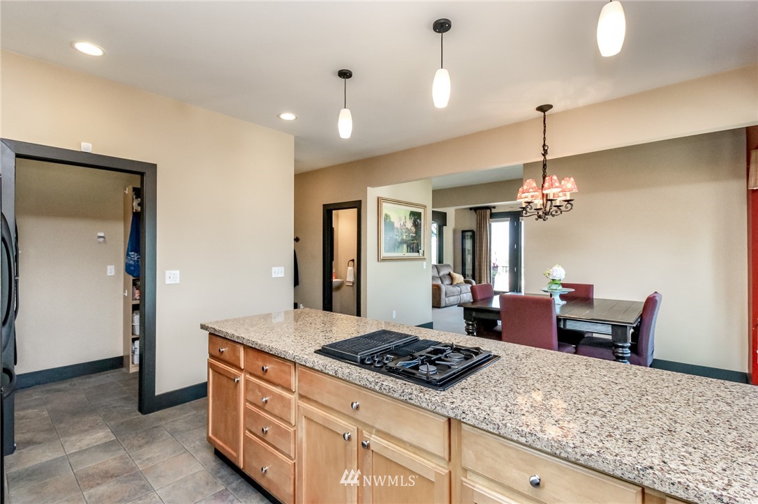 1203 South 3rd Street Renton, WA 98057 - Photo 11 of 40 a kitchen with a stove and cabinets