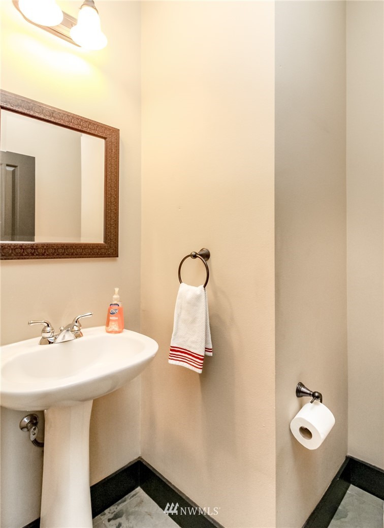 1203 South 3rd Street Renton, WA 98057 - Photo 14 of 40 a bathroom with a sink and mirror