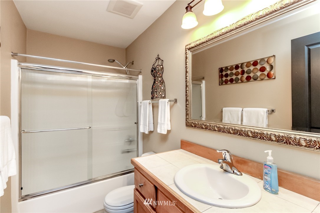 1203 South 3rd Street Renton, WA 98057 - Photo 30 of 40 a bathroom with a sink toilet and shower