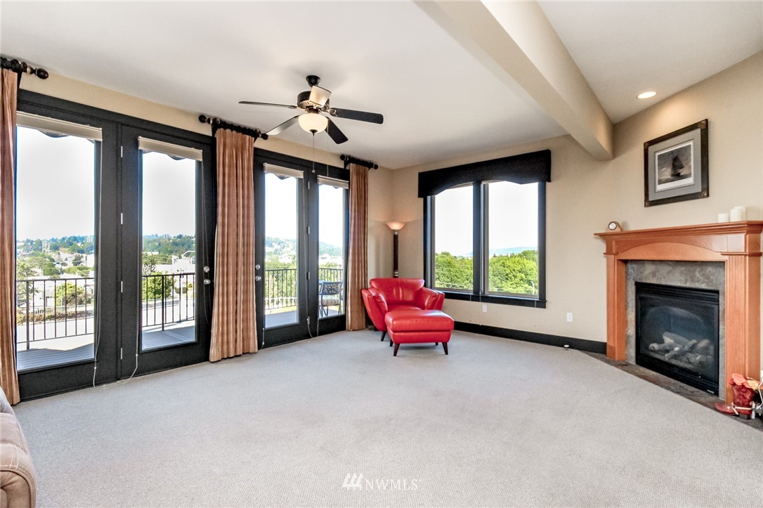 1203 South 3rd Street Renton, WA 98057 - Photo 5 of 40 a living room with furniture and a fireplace