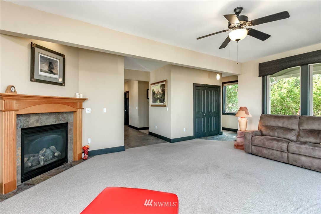 1203 South 3rd Street Renton, WA 98057 - Photo 7 of 40 a living room with furniture and a fireplace