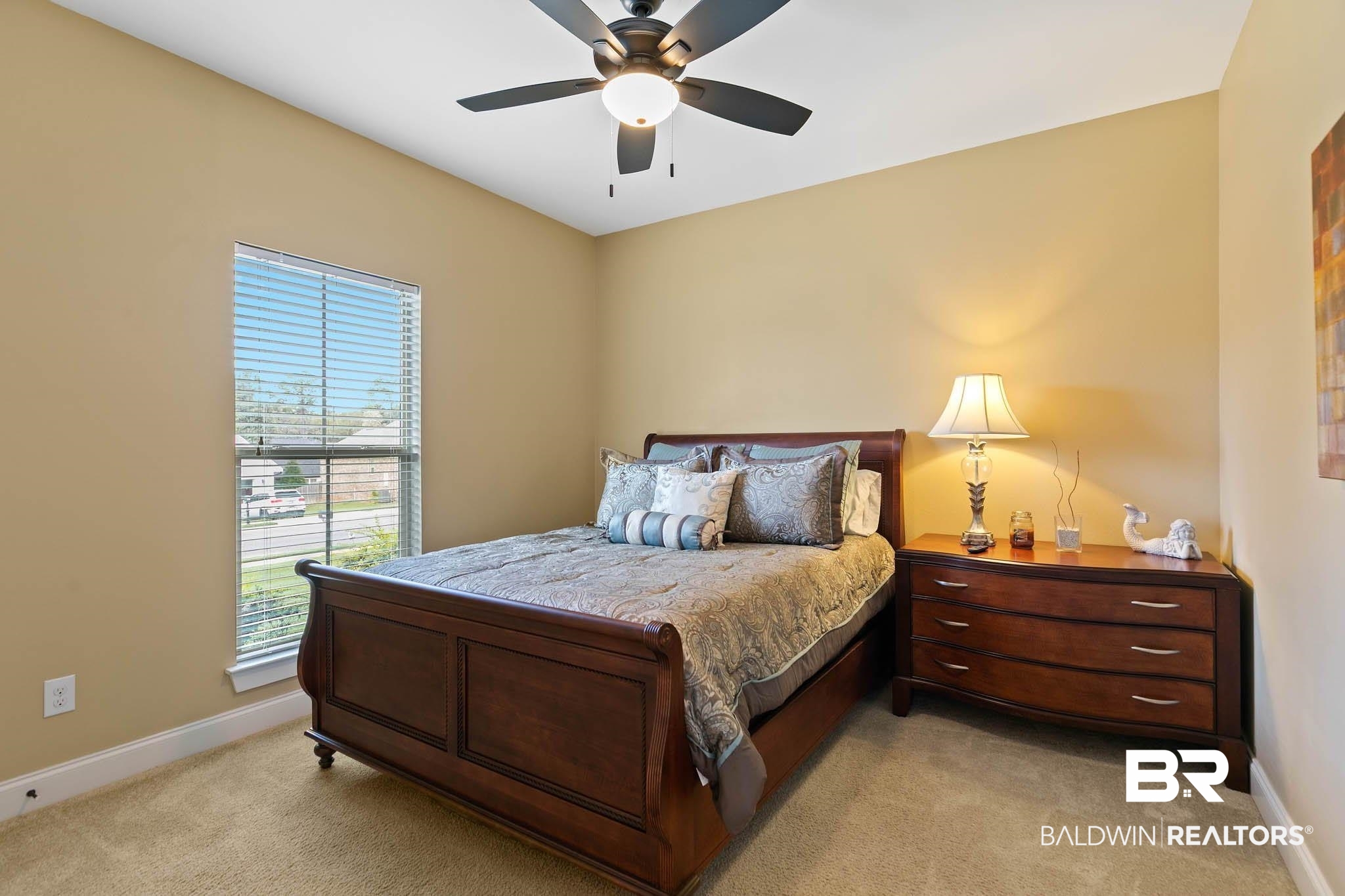 19740 Bunker Loop Fairhope, AL 36532 - Photo 24 of 33 Bedroom with light colored carpet and ceiling fan