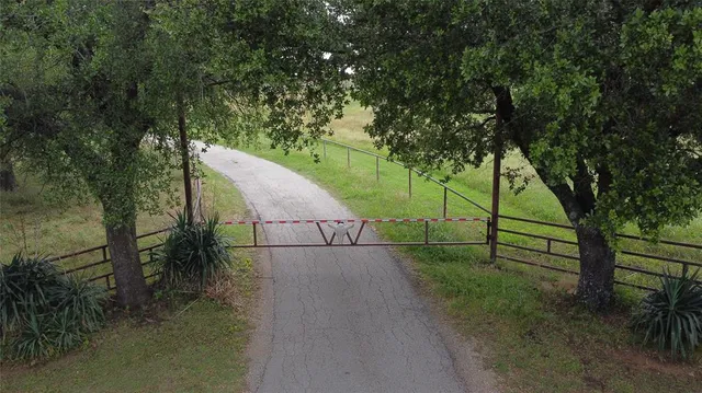 a view of an outdoor space and tennis court