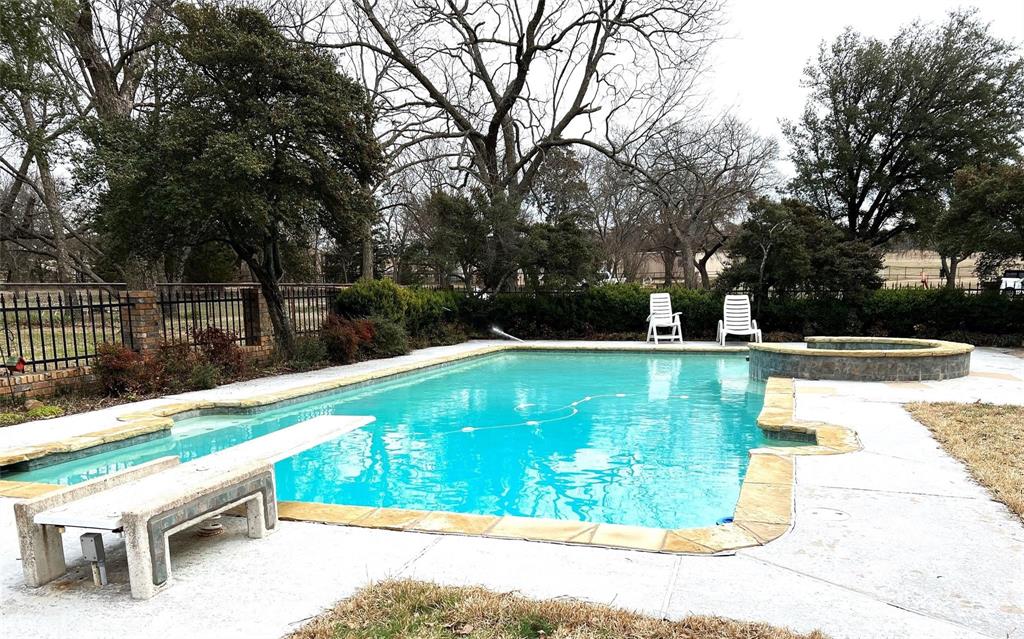 2815 Farm To Market Road 3092 Gainesville, TX 76240 - Photo 14 of 28 a view of a swimming pool with a patio