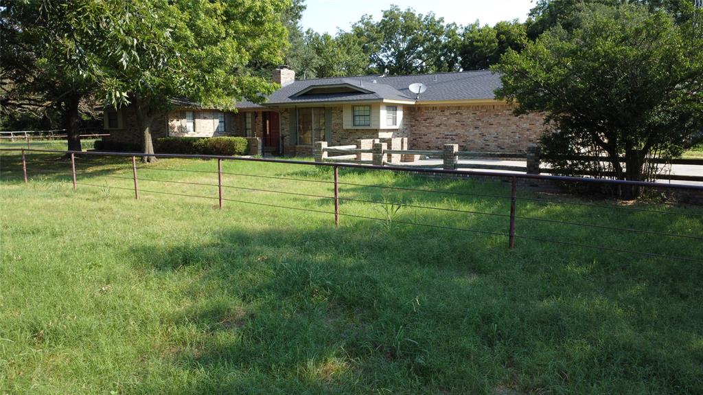 2815 Farm To Market Road 3092 Gainesville, TX 76240 - Photo 24 of 28 a view of a house with a big yard