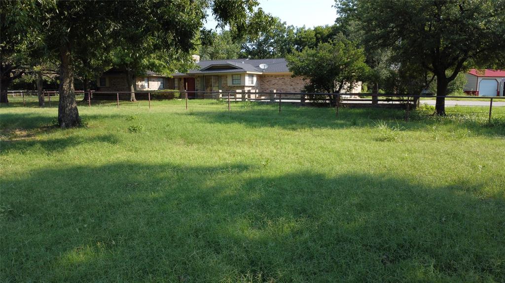 2815 Farm To Market Road 3092 Gainesville, TX 76240 - Photo 25 of 28 a view of a house with a big yard and a large trees