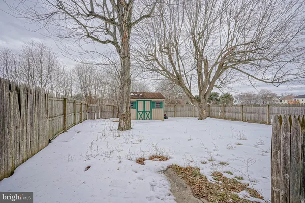 a view of snow on the side of the road