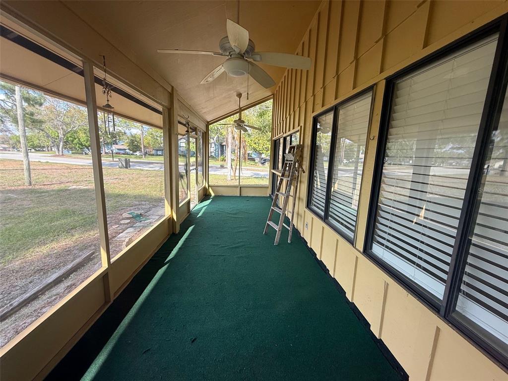 9085 Heather Boulevard Weeki Wachee, FL 34613 - Photo 13 of 15 a view of a room with wooden floor and windows