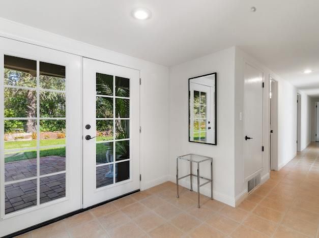 a view of an empty room with windows