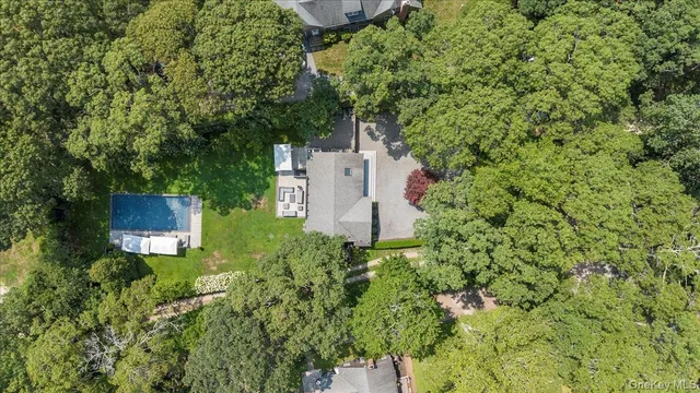 an aerial view of a house with a yard and garden