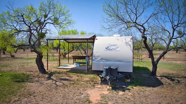 a view of a city with lush green forest