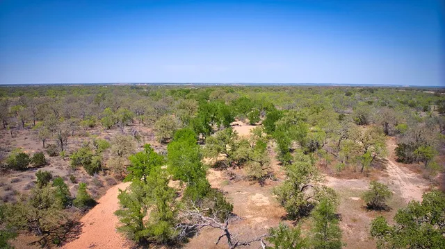 a view of a lake with a yard