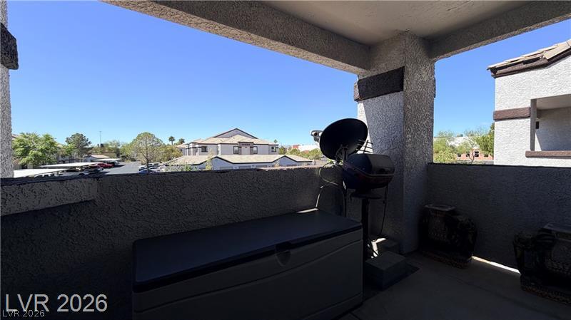 7255 West Sunset Road, Unit 2027 Las Vegas, NV 89113 - Photo 4 of 38 An elevated covered balcony overlooks the surrounding neighborhood.