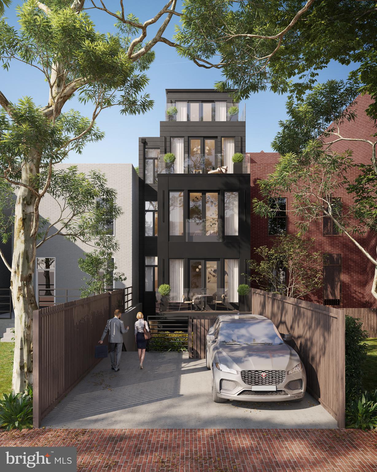 1827 S Street Northwest, Unit 2 Washington, DC 20009 - Photo 5 of 5 a car parked in front of a brick house