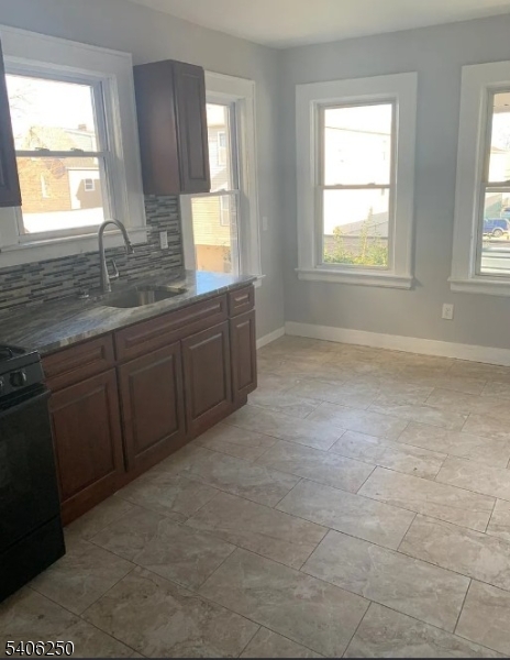 543 Court Street Elizabeth Port, NJ 07206 - Photo 3 of 7 a bathroom with a sink window and mirror