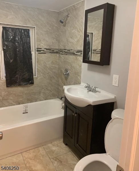 543 Court Street Elizabeth Port, NJ 07206 - Photo 7 of 7 a bathroom with a sink and a mirror