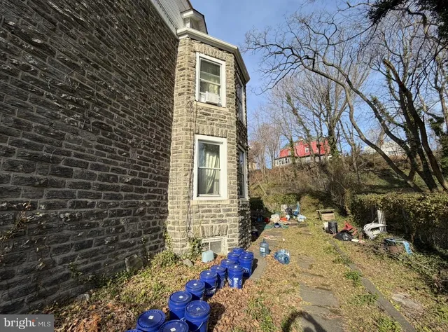 a view of a backyard with a tree