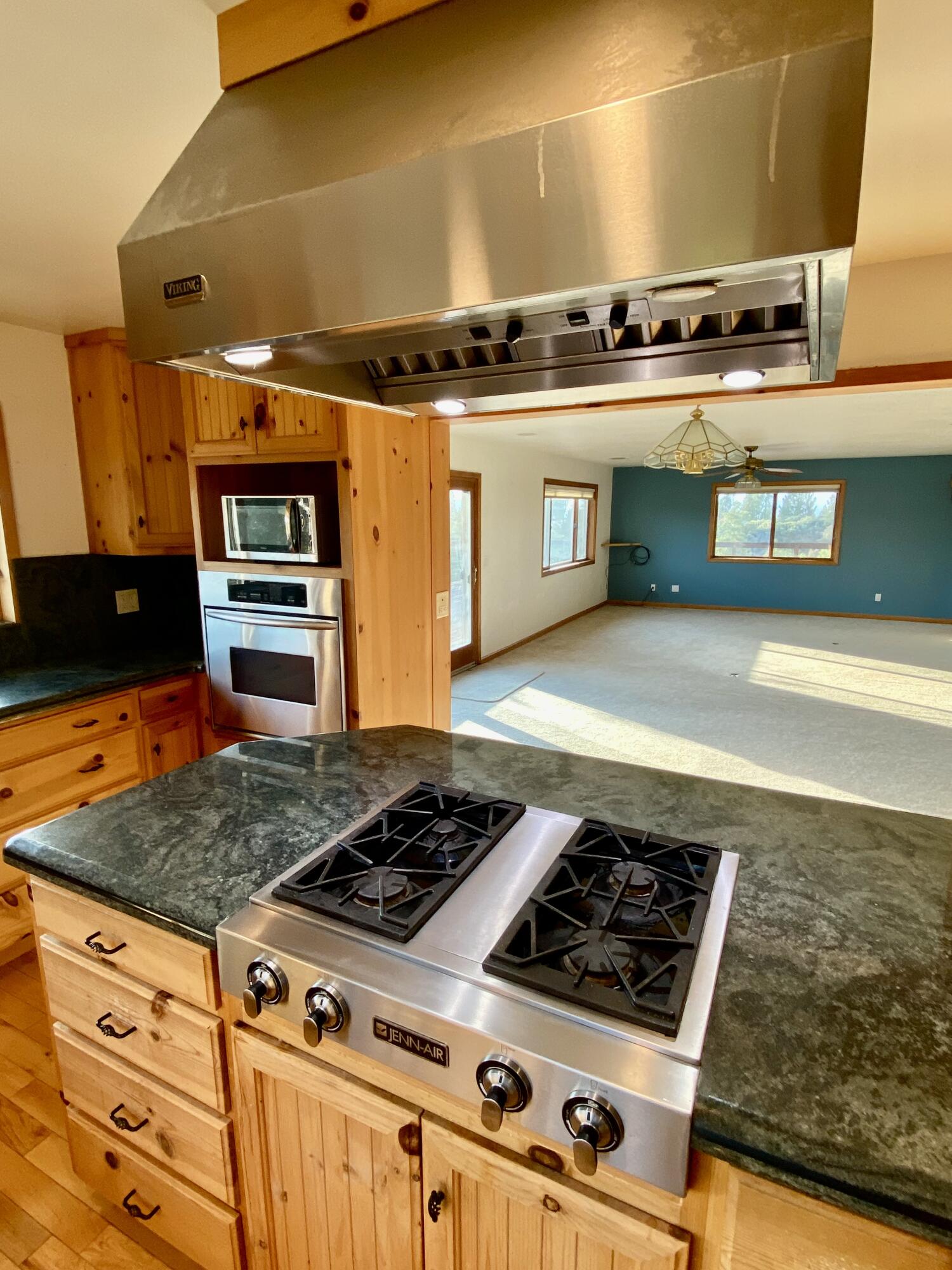 30503 Terry Mill Road Montgomery Creek, CA 96065 - Photo 11 of 75 a stove top oven sitting inside of a kitchen