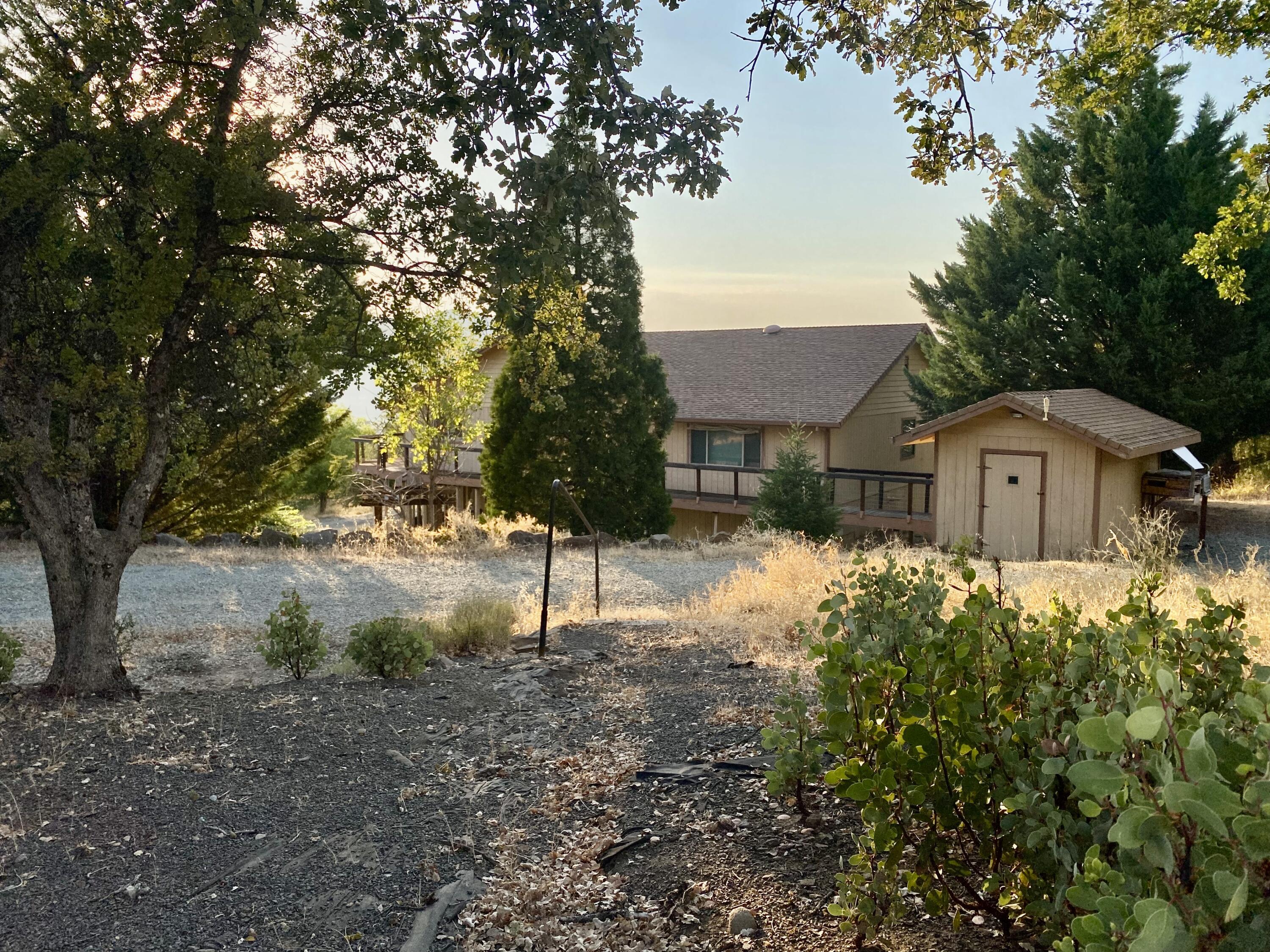 30503 Terry Mill Road Montgomery Creek, CA 96065 - Photo 19 of 75 a front view of a house with a yard