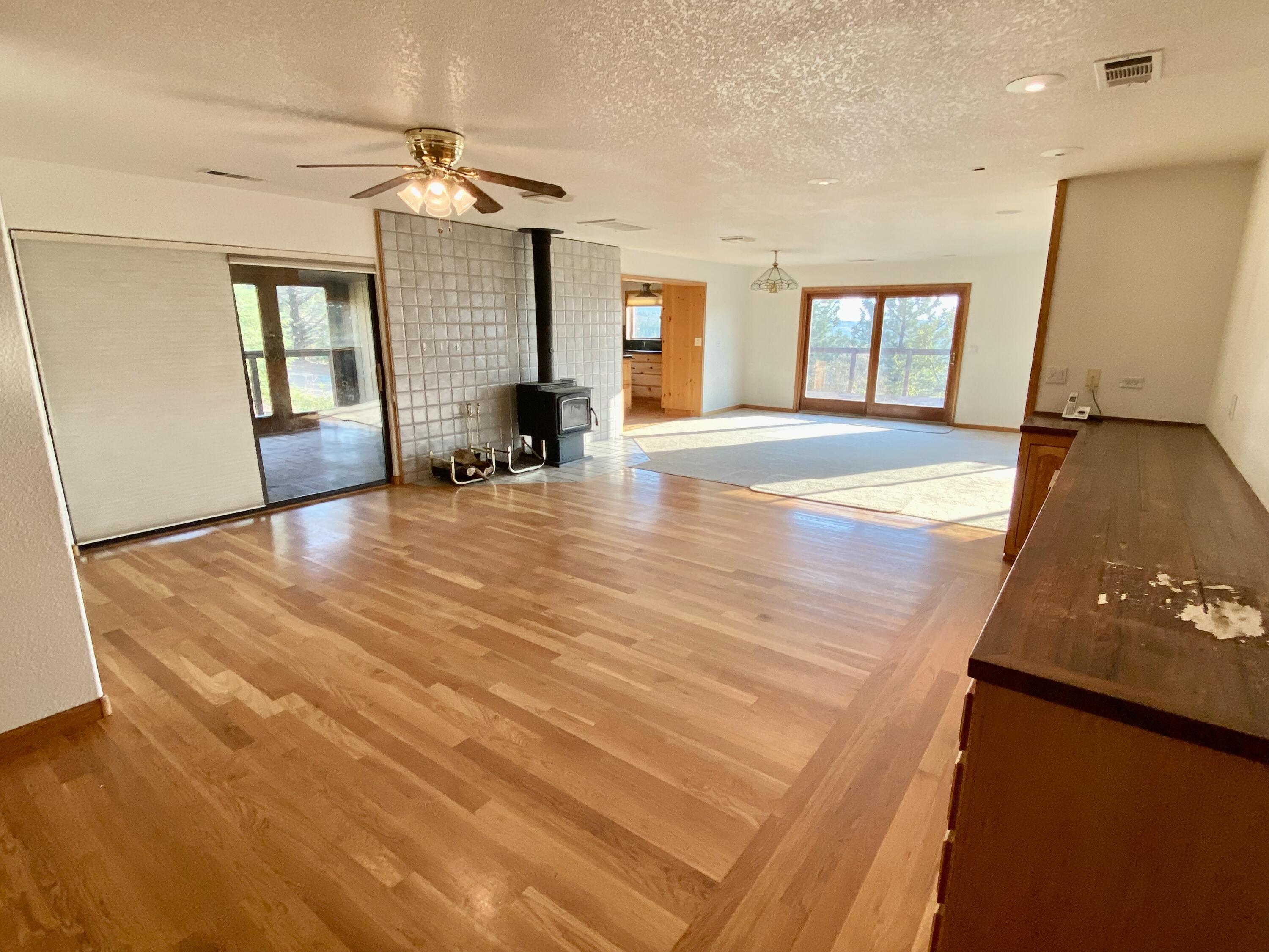 30503 Terry Mill Road Montgomery Creek, CA 96065 - Photo 24 of 75 a view of an empty room with window and wooden floor