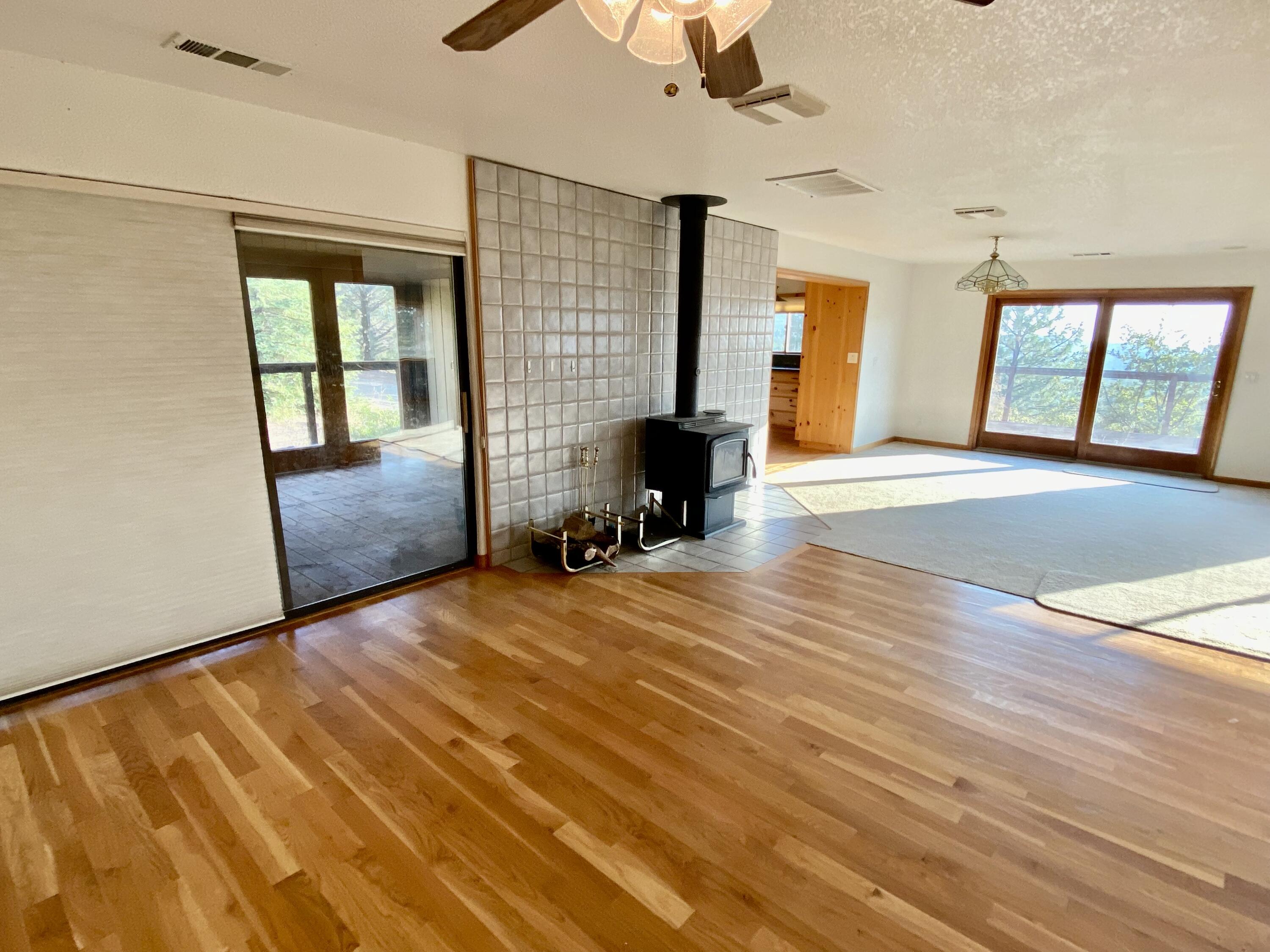 30503 Terry Mill Road Montgomery Creek, CA 96065 - Photo 25 of 75 a view of an empty room with window and wooden floor