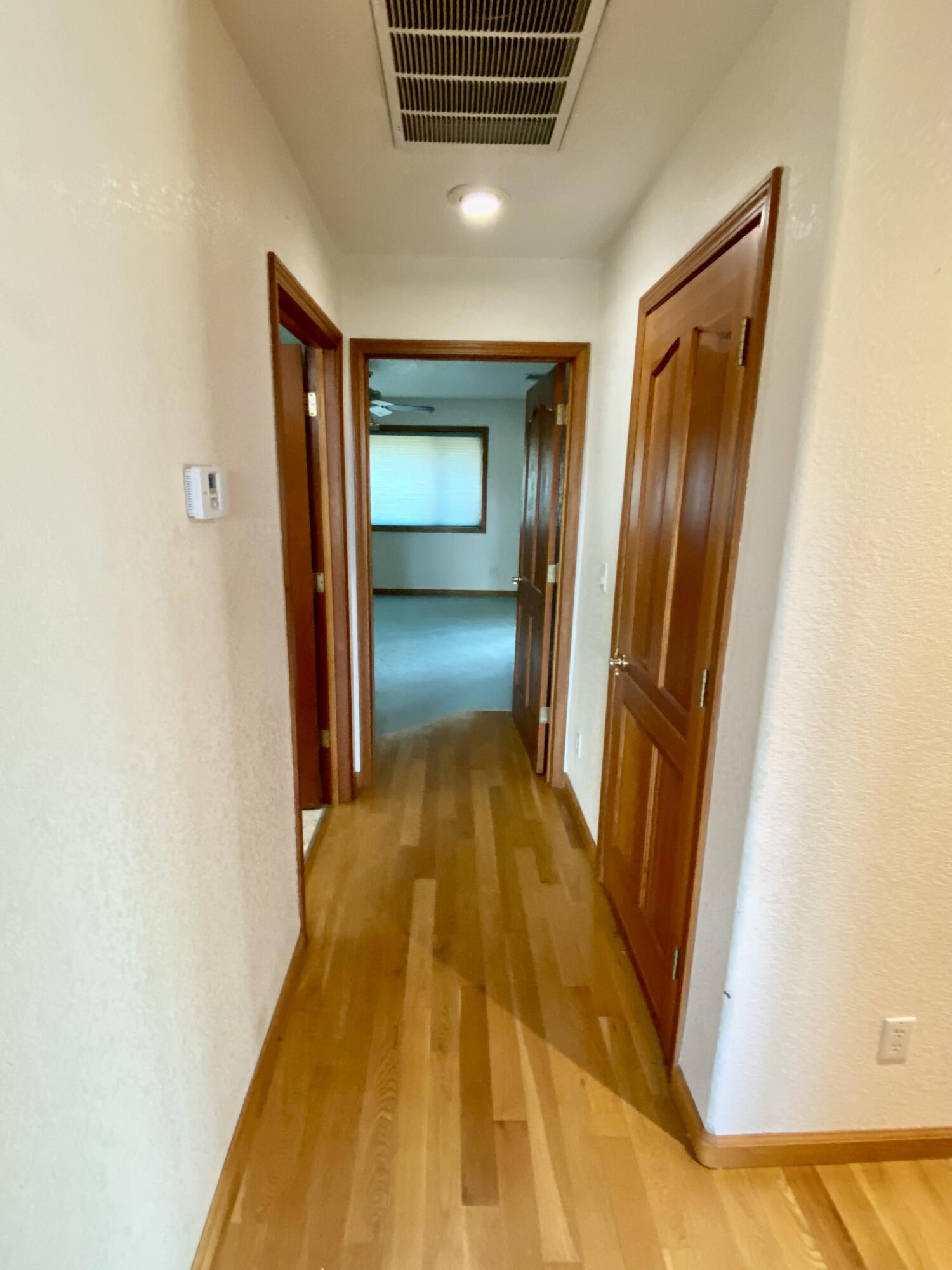 30503 Terry Mill Road Montgomery Creek, CA 96065 - Photo 27 of 75 a view of gallery with wooden floor