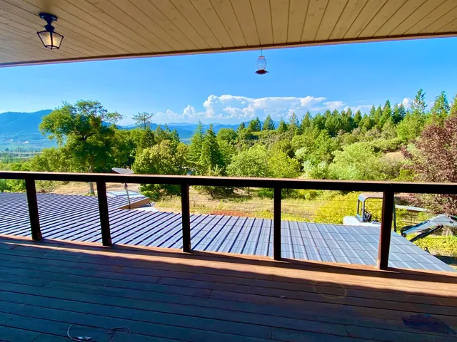 a view of a lake with houses in the back