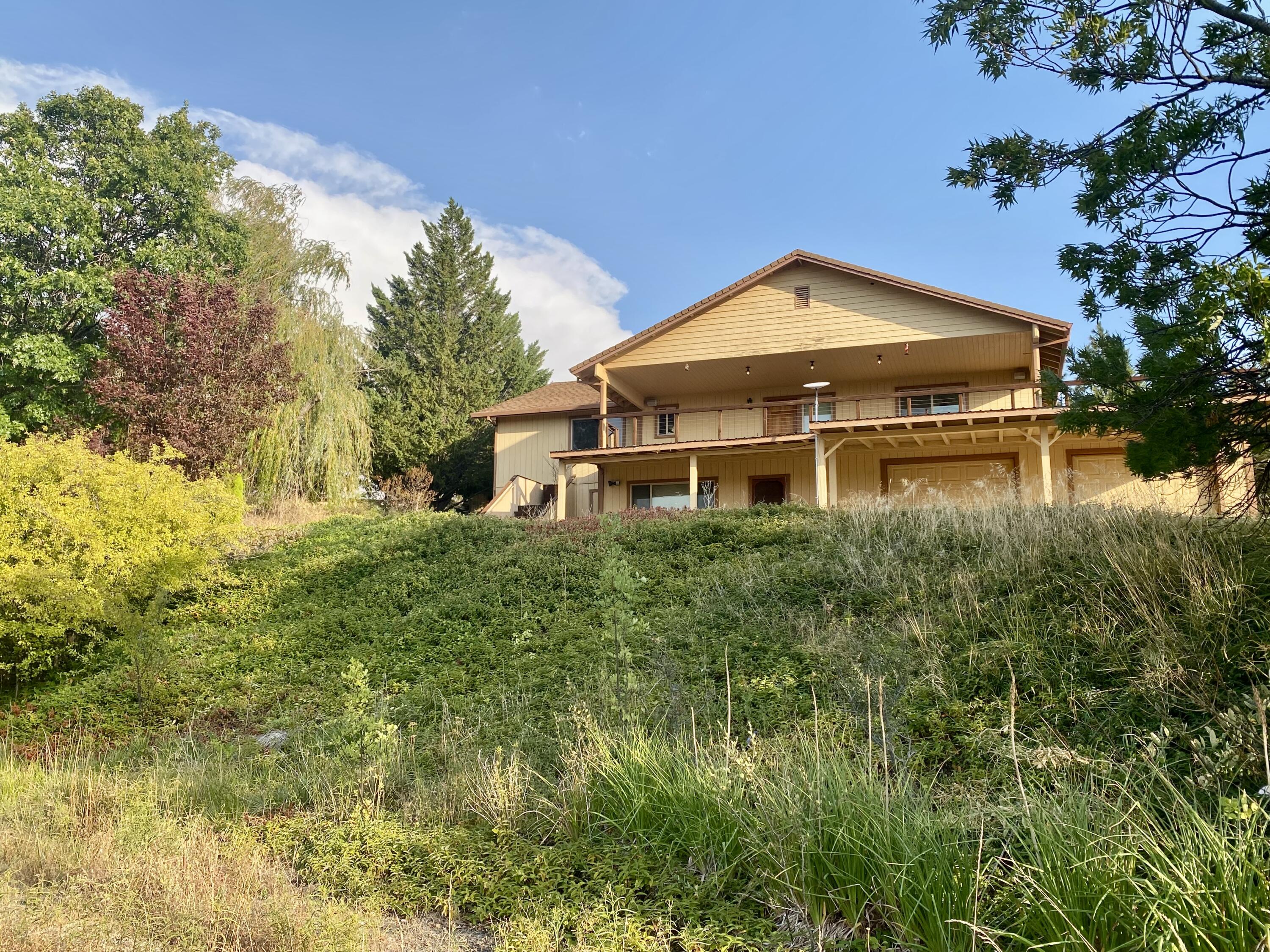 30503 Terry Mill Road Montgomery Creek, CA 96065 - Photo 4 of 75 a front view of a house with a yard