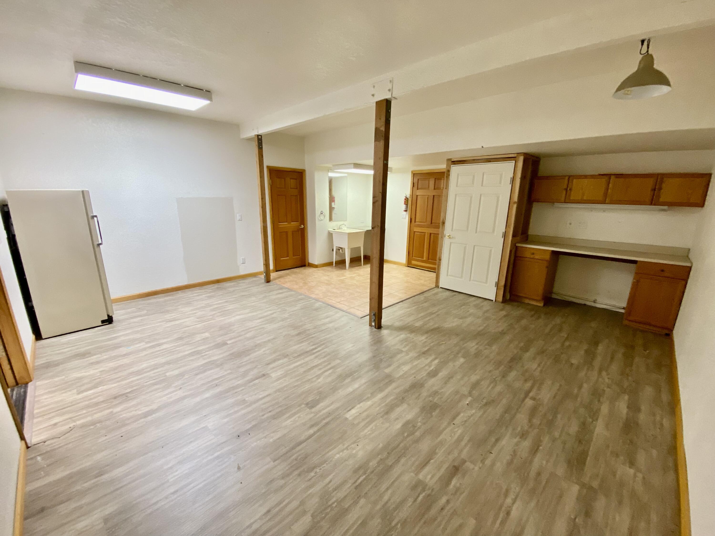 30503 Terry Mill Road Montgomery Creek, CA 96065 - Photo 54 of 75 a view of an empty room with wooden floor and a window
