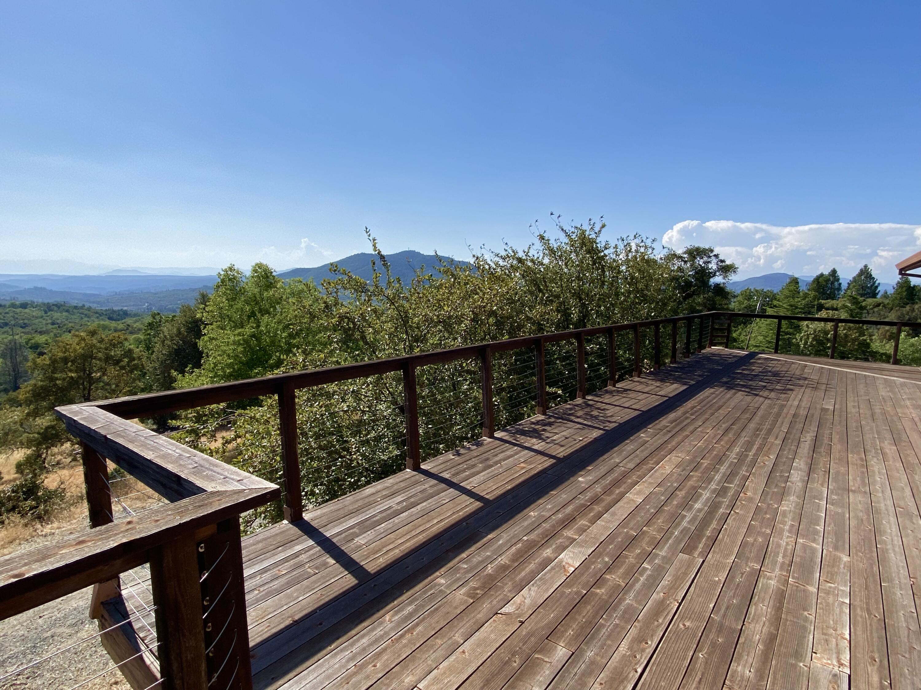 30503 Terry Mill Road Montgomery Creek, CA 96065 - Photo 7 of 75 a view of balcony with wooden floor and fence