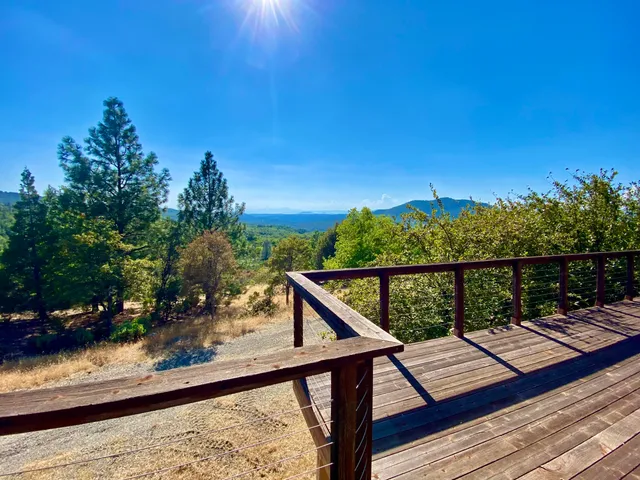 a kitchen with granite countertop a sink and cabinets