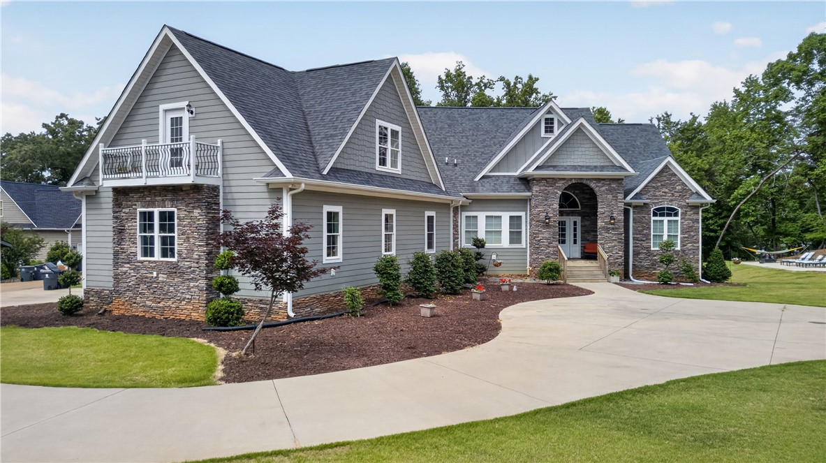 206 James Hare Road Anderson, SC 29626 - Photo 1 of 37 Architectural interest abounds with gables and stone accents adorning this welcoming home's facade.
