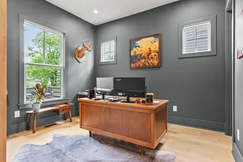 a workspace with furniture and window