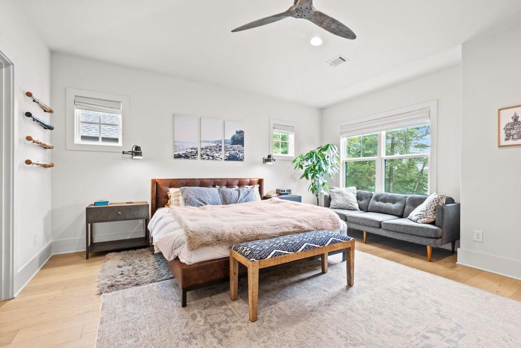 1412 Carroll Drive Northwest Atlanta, GA 30318 - Photo 23 of 42 a spacious bedroom with a bed and a couch