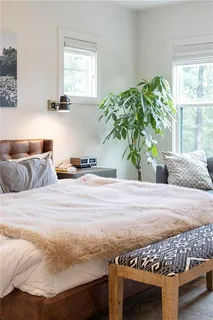 a bedroom with a bed and a cabinets