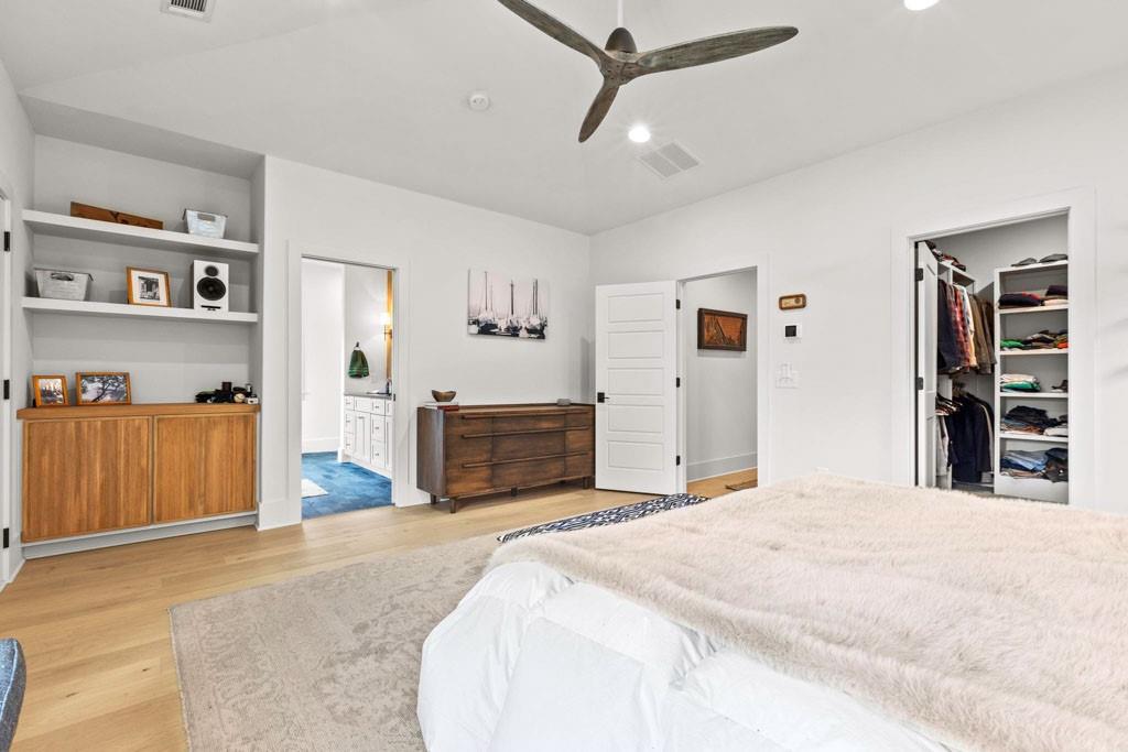 1412 Carroll Drive Northwest Atlanta, GA 30318 - Photo 25 of 42 a bedroom with a bed and a cabinets