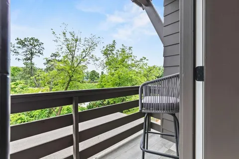 a spacious bathroom with double vanity and a mirror