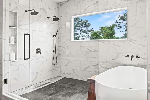 a kitchen with stainless steel appliances granite countertop a stove and a refrigerator