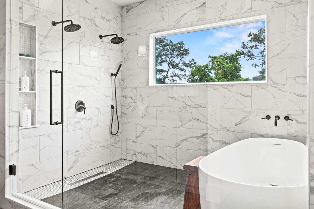 1412 Carroll Drive Northwest Atlanta, GA 30318 - Photo 28 of 42 a bathroom with a white bath tub and a shower