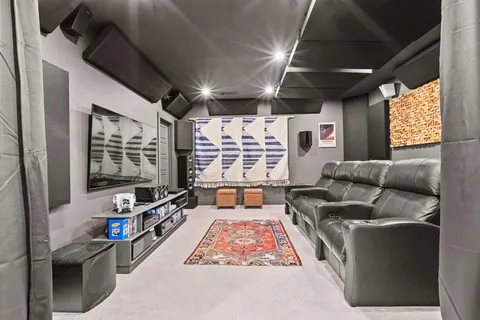 a blue bed sitting in a bedroom next to a blue wall