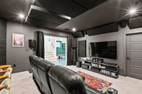a kitchen with a wooden floor and cabinets