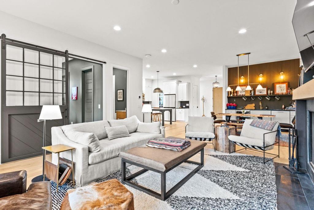 1412 Carroll Drive Northwest Atlanta, GA 30318 - Photo 9 of 42 a living room with furniture and a dining table with kitchen view