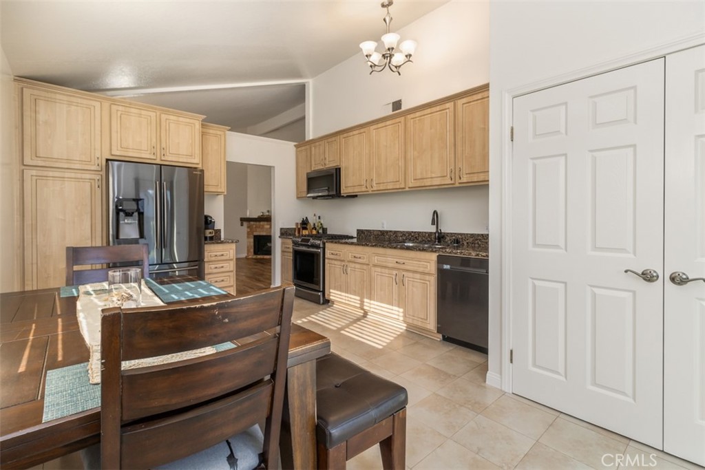 27432 Pinavete Mission Viejo, CA 92691 - Photo 13 of 37 a kitchen with cabinets and stainless steel appliances