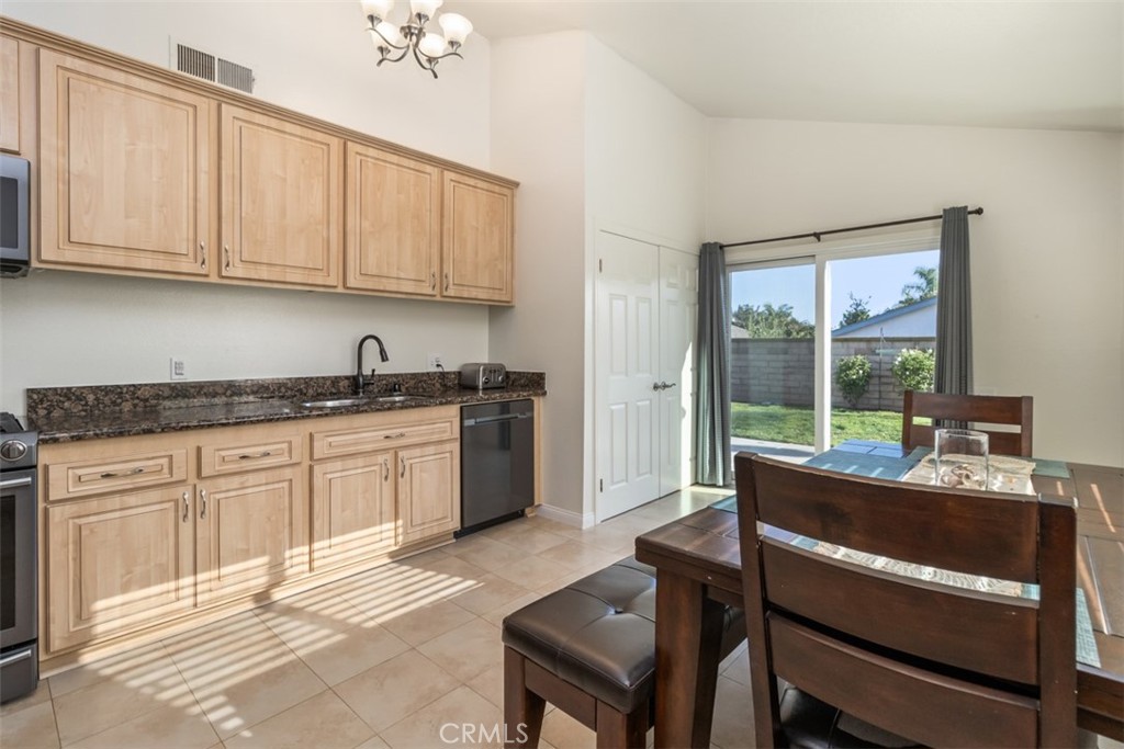 27432 Pinavete Mission Viejo, CA 92691 - Photo 14 of 37 a kitchen with a stove a sink and cabinets